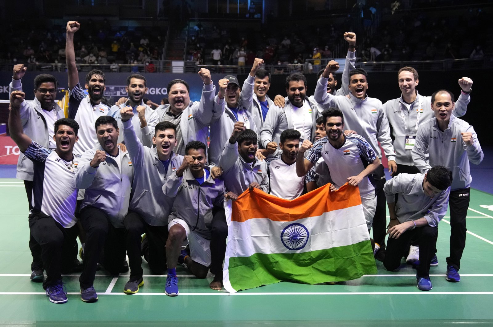 Members of the Indian team pose with the national flag after winning Thomas Cup title, Bangkok, Thailand, May 15, 2022. (AP Photo)