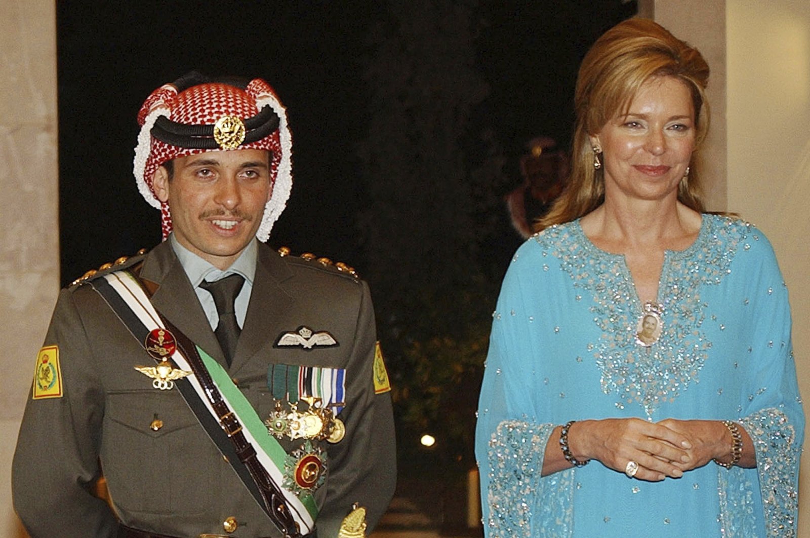 Then-Crown Prince Hamzah of Jordan (L) with his mother Queen Noor, during his wedding ceremony in Amman, Jordan, May 27, 2004. (AP Photo)