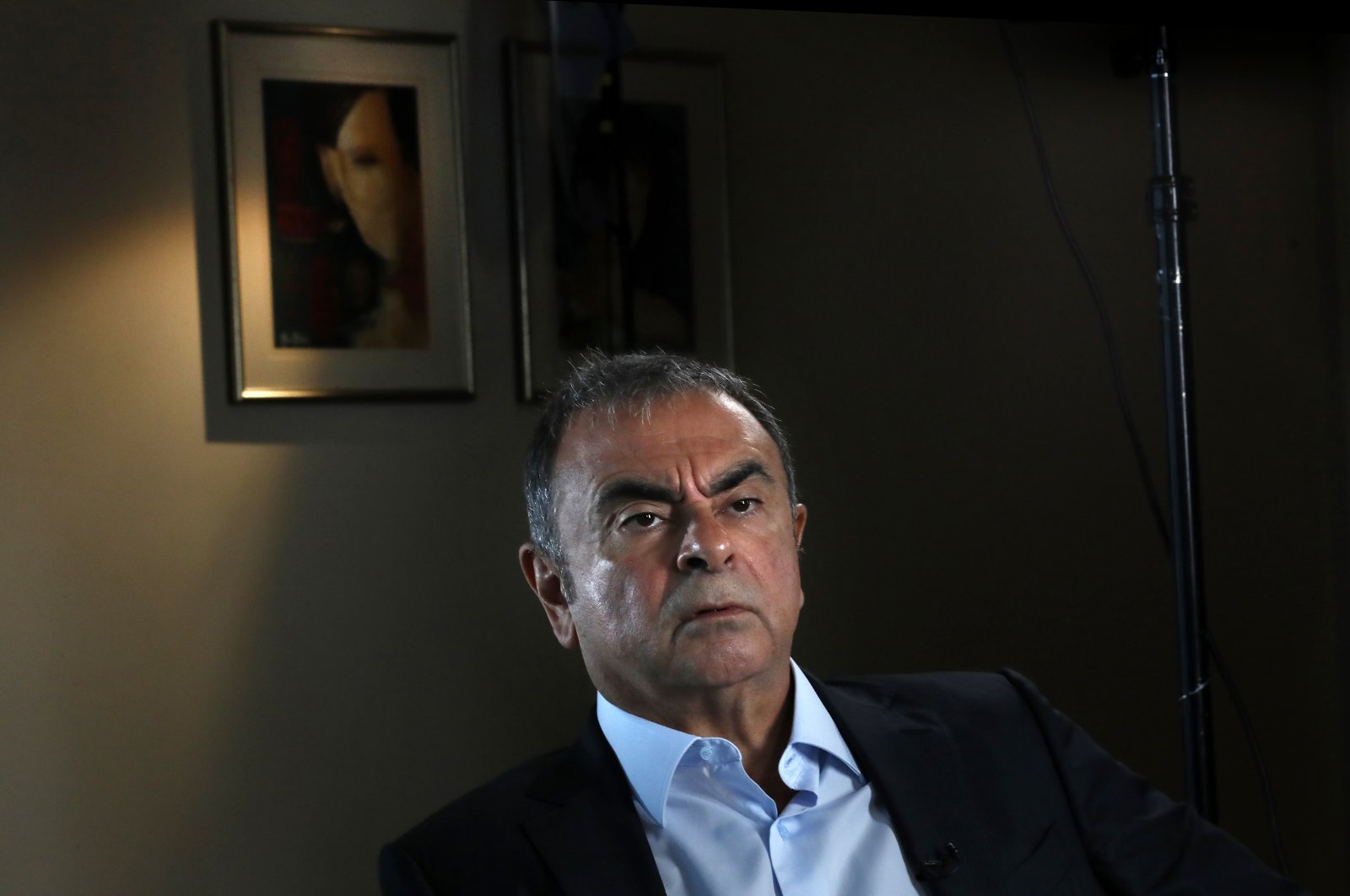 Former Nissan executive Carlos Ghosn speaks during an interview with The Associated Press, in Dbayeh, north of Beirut, Lebanon, May 25, 2021. Lebanon received from Interpol a wanted notice for disgraced auto tycoon Carlos Ghosn on May 19, 2022, four weeks after French prosecutors issued an international arrest warrant for him, Lebanese judicial officials said. (AP File Photo)