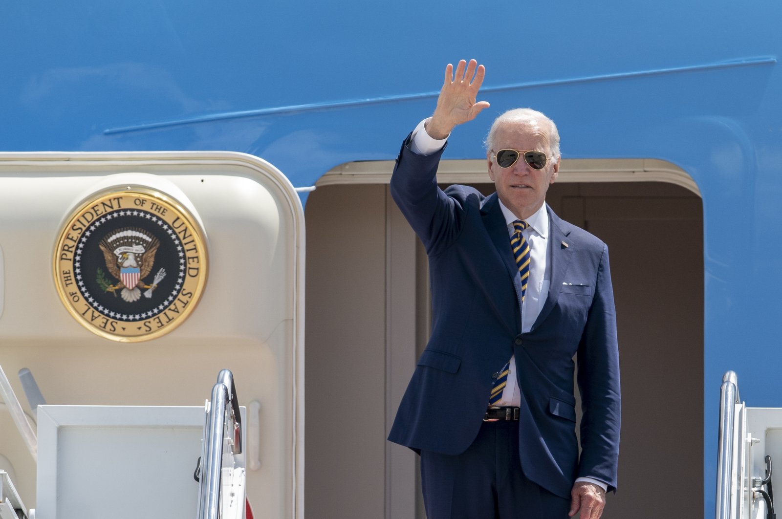 President Joe Biden waves as he boards Air Force One at Andrews Air Force Base, Md., Thursday, May 19, 2022, to travel to Seoul, Korea to begin his first trip to Asia as President. (AP Photo/Gemunu Amarasinghe)