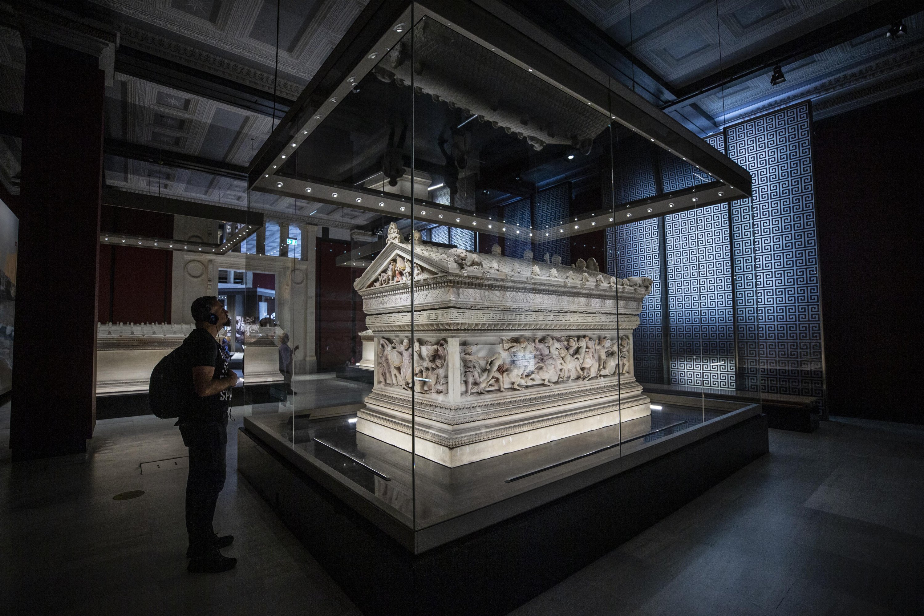 A visitor examines the Alexander Sarcophagus on display at the Istanbul Archaeology Museums, Istanbul, Turkey, May 18, 2022. (AA Photo)