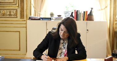 Sweden's Minister of Foreign Affairs Ann Linde signs Sweden's application for NATO membership at the Ministry of Foreign Affairs in Stockholm, Sweden, 17 May 2022. (EPA)