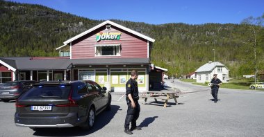 Police officers work on the scene of a multiple stabbing in Nore, Norway, May 20, 2022. (AP Photo)