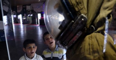 Children look at exhibits as part of "Space Adventure Exhibition" showcasing NASA's space journeys over 50 years, in Gaziantep, Turkey, May 19, 2022. (AA Photo)