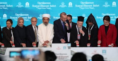President Recep Tayyip Erdoğan pushes the button for laying the foundation, in the company of the Fener Greek patriarch (third right) and the Armenian patriarch (second right), in Istanbul, Turkey, May 20, 2022. (DHA PHOTO)
