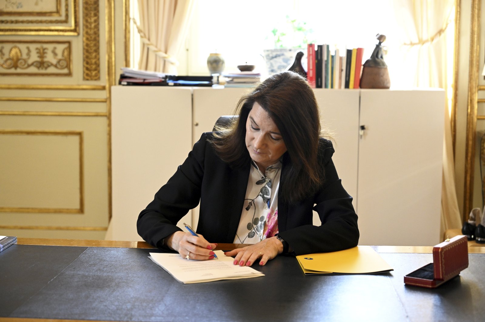 Sweden&#039;s Minister of Foreign Affairs Ann Linde signs Sweden&#039;s application for NATO membership at the Ministry of Foreign Affairs in Stockholm, Sweden, 17 May 2022. (EPA)