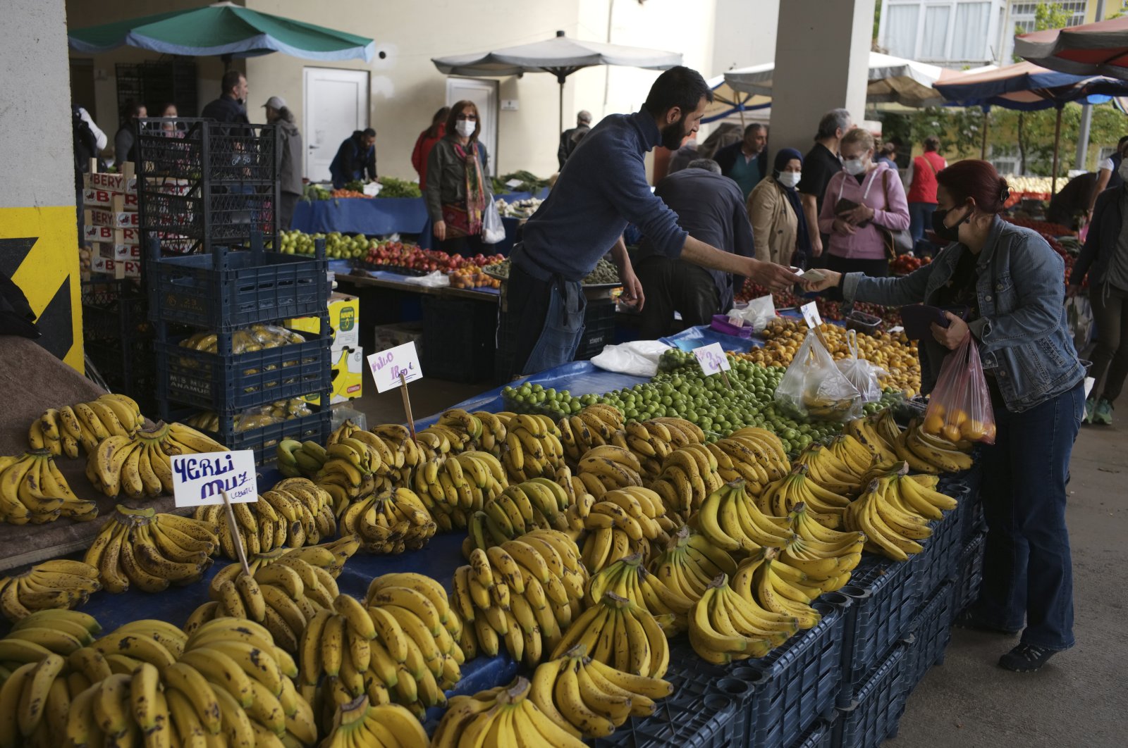 People buy local products at a food market, in the capital Ankara, Turkey, May 8, 2022. (AP Photo)