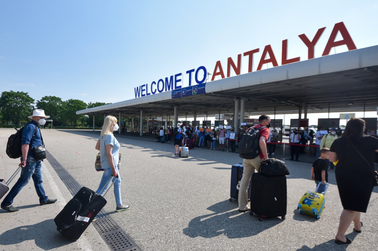 Tourists leave an airport after arriving in Antalya, one of the most popular tourist destinations in the Mediterranean, Turkey, June 22, 2021. (DHA Photo)