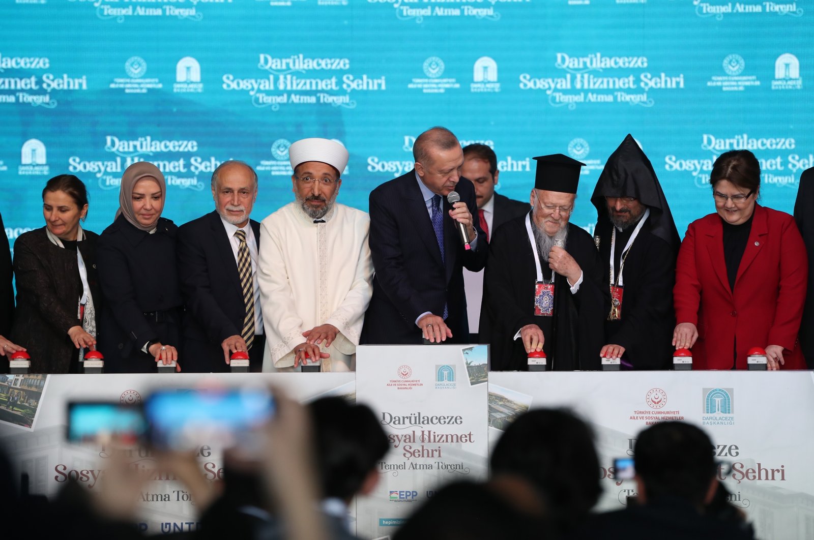 President Recep Tayyip Erdoğan pushes the button for laying the foundation, in the company of the Fener Greek patriarch (third right) and the Armenian patriarch (second right), in Istanbul, Turkey, May 20, 2022. (DHA PHOTO)
