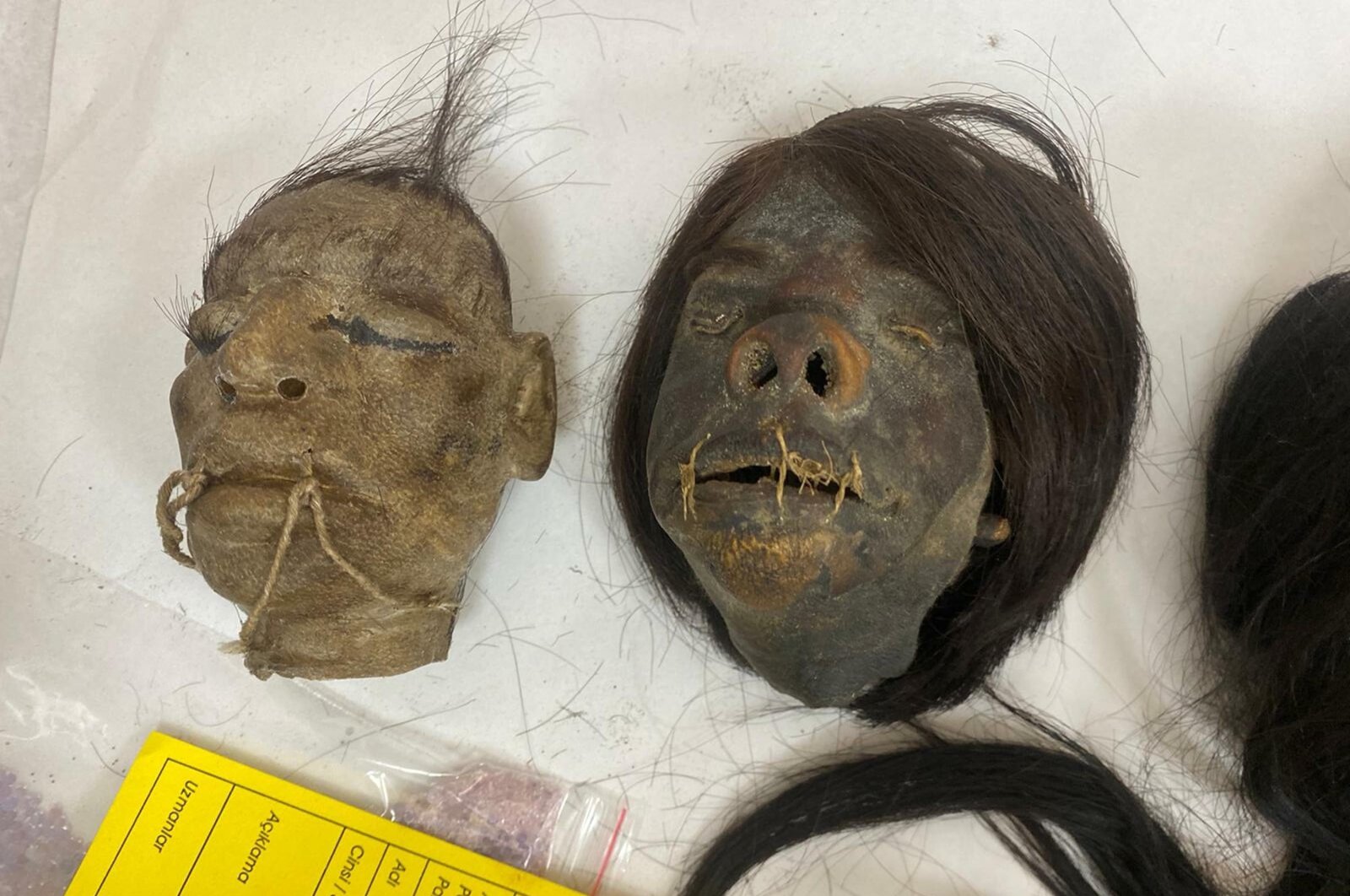 "Tsantas," or "shrunken" heads, believed to be from Peru and confiscated by authorities in December 2021 are cataloged in a police station in, Izmir, Turkey, May 20, 2022. (AA Photo)