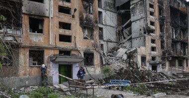 A Russian Emergency Ministry serviceman inspects the rubble of a destroyed house in Mariupol, Ukraine, May 21, 2022. (EPA Photo)