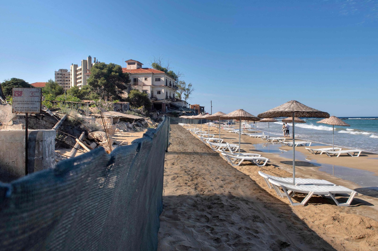 Sunbeds set up on a newly opened beach in the fenced-off area of Varosha, Turkish Republic of Northern Cyprus, May 21, 2022. (AFP Photo)