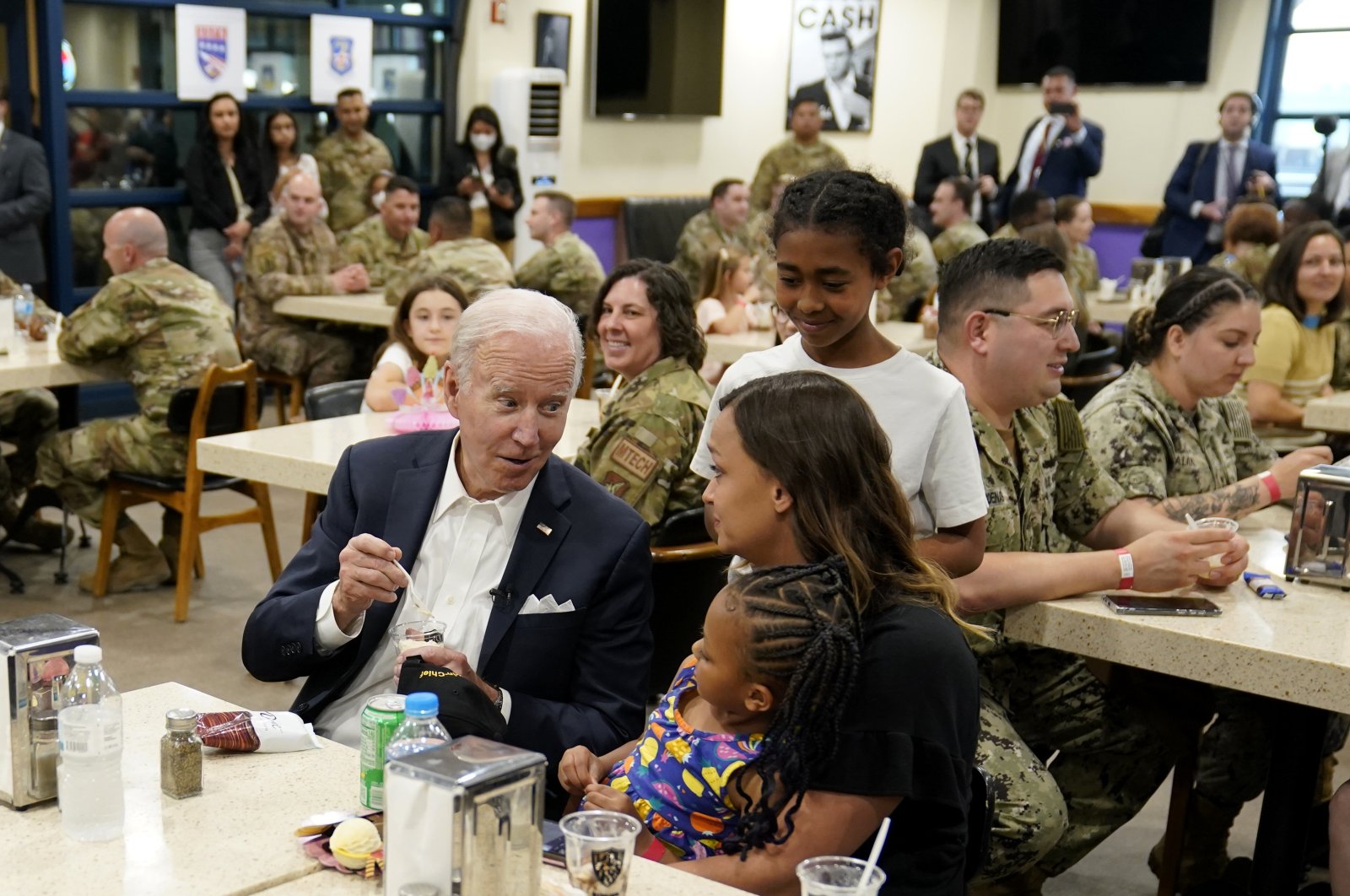 U.S. President Joe Biden, center left, talks with the family of an American service member at Osan Air Base, in Pyeongtaek, South Korea, May 22, 2022. (AP Photo)