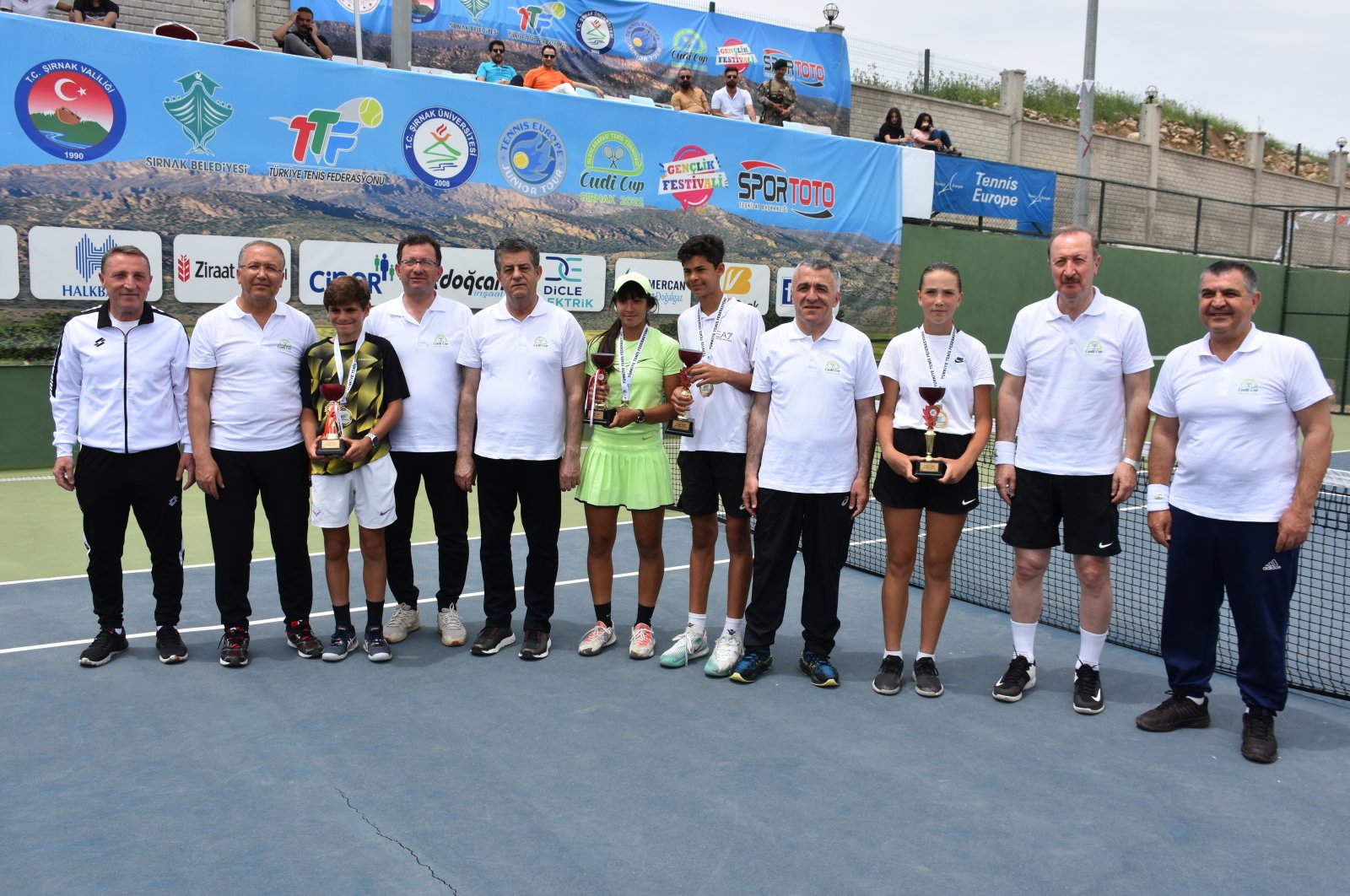 Winners and dignitaries pose for a photo on the final day of the Cudi Cup International Tennis Tournament, Şırnak, southeastern Turkey, May 22, 2022. (AA Photo)