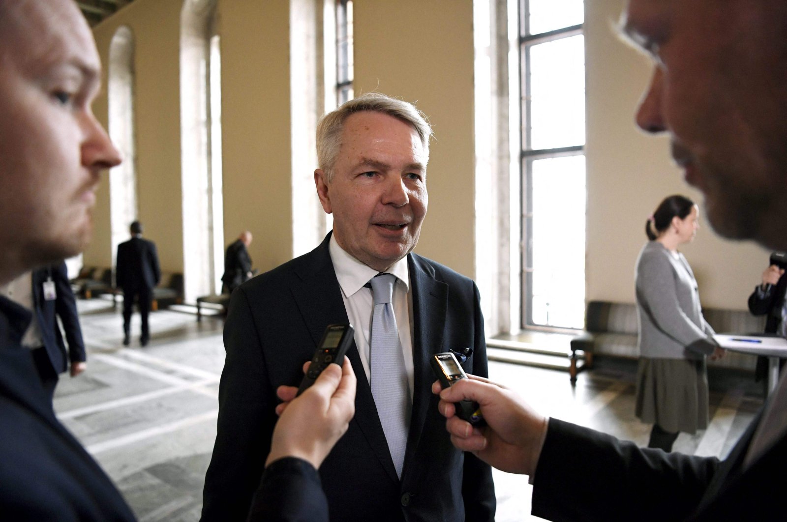Finnish Foreign Minister Pekka Haavisto (C) speaks to the press after the vote of the plenary session at the Finnish parliament about the NATO membership bid in Helsinki, Finland, on May 17, 2022. (AFP File Photo)