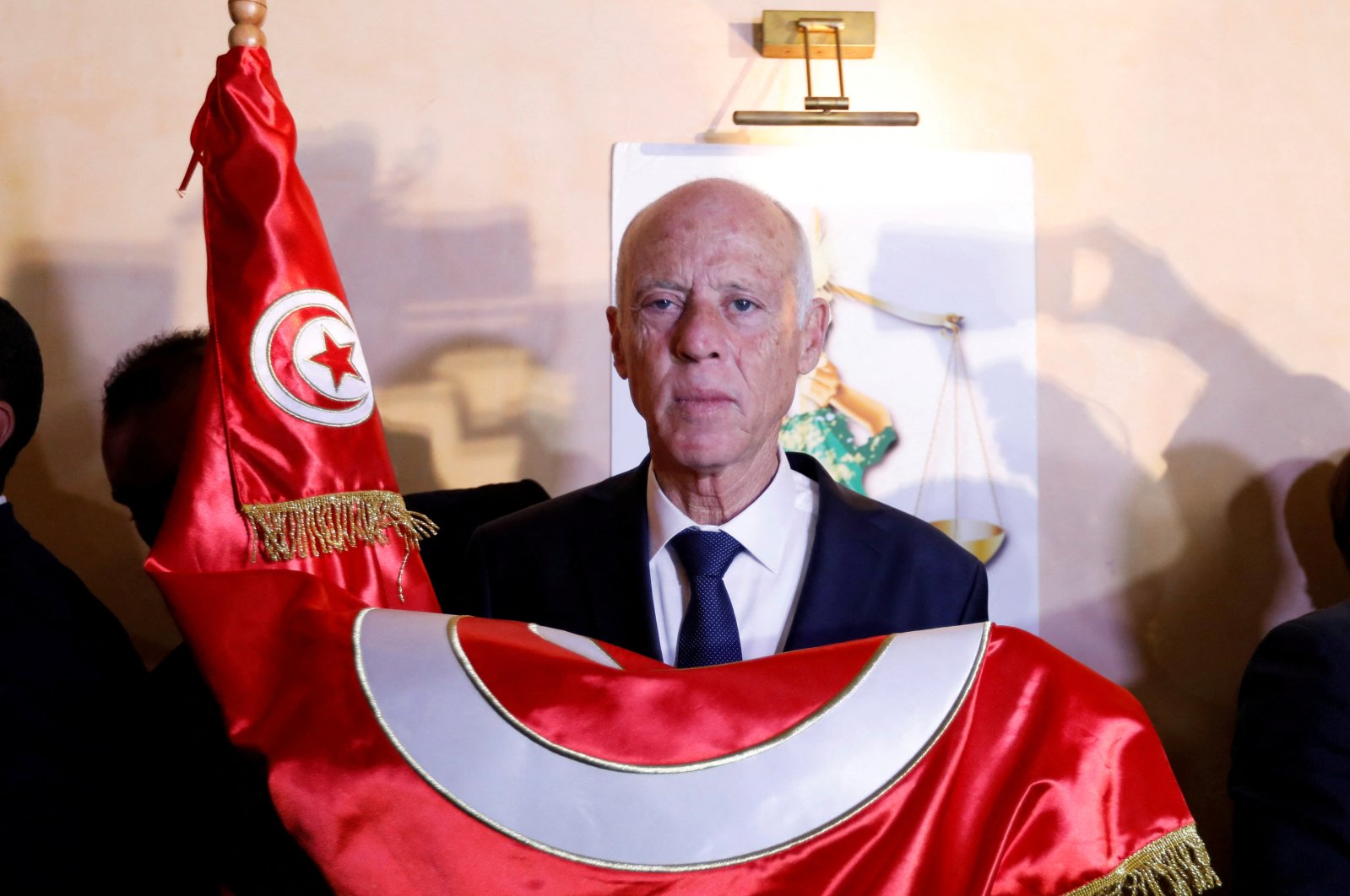  Tunisian presidential candidate Kais Saied reacts after exit poll results were announced in a second-round runoff of the presidential election in Tunis, Tunisia Oct.13, 2019. (Reuters File Photo)