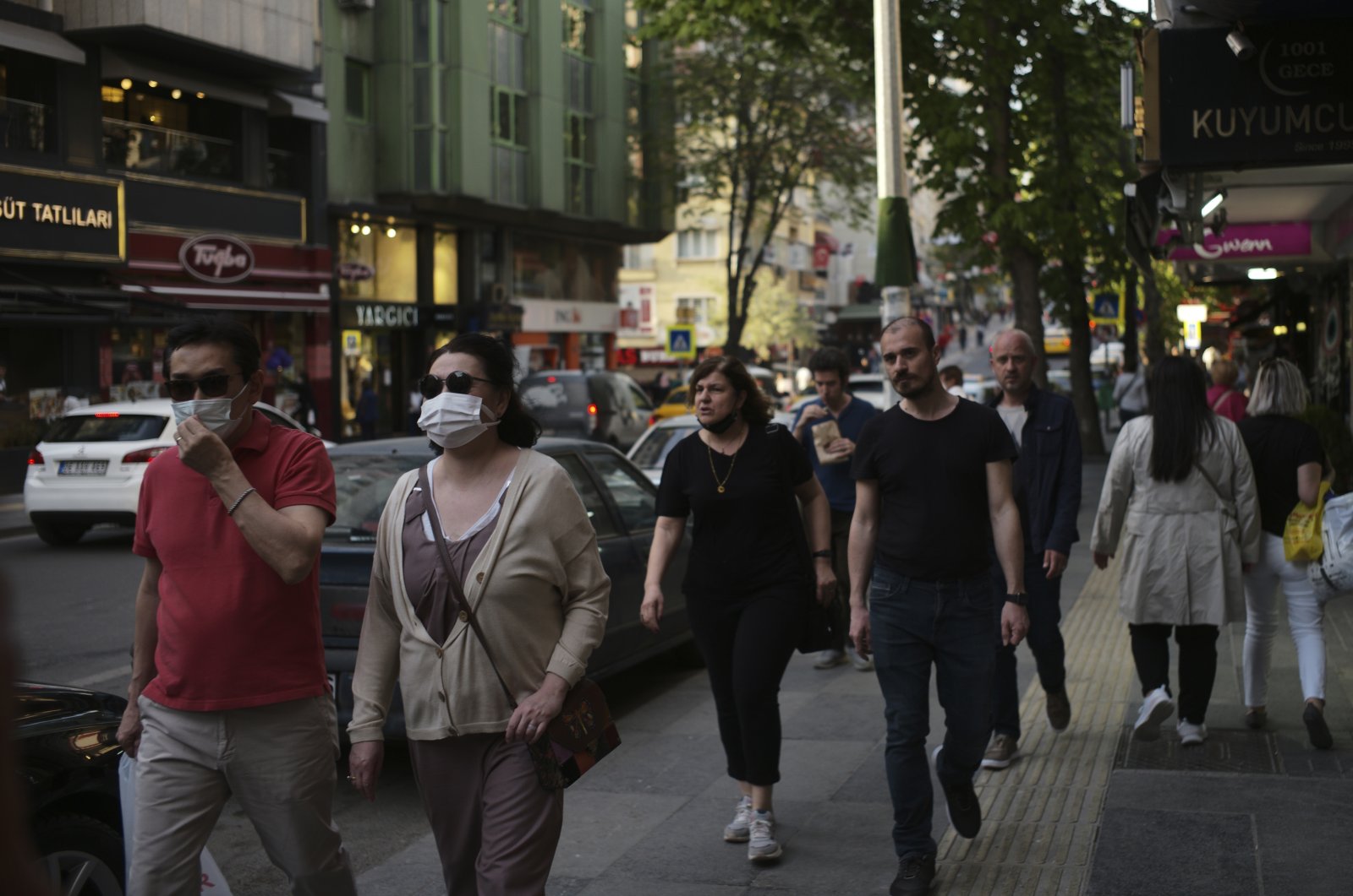 People walk along a street in Ankara, Turkey, April 26, 2022. (AP Photo)