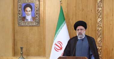 Iranian President Ebrahim Raisi delivering a statement prior to departing Tehran&#039;s Mehrabad airport to Oman for a visit, Iran, May 23, 2022. (Iranian Presidency via AFP)