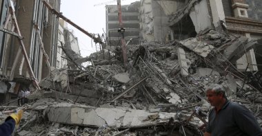 Rubble remains from a 10-story commercial building under construction that collapsed killing several people in the southwestern city of Abadan, Iran, May 23, 2022. (Fars News Agency via AP)