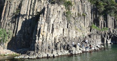 Tourists walk and take pictures among the lava columns on the edge of the Güzelcehisar beach, in Bartın, Turkey, May 22, 2022. (AA Photo)