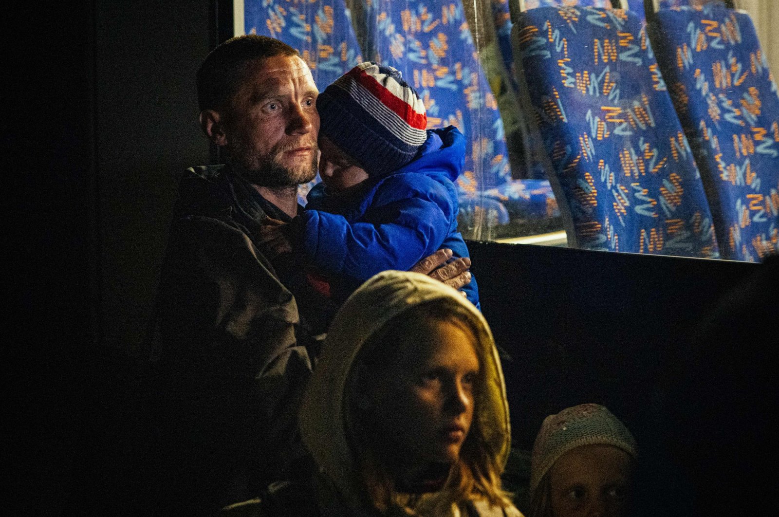A man and his children arrive from Mariupol at a registration and processing area for internally displaced people, Zaporizhzhia, Ukraine, May 8, 2022. (AFP Photo)