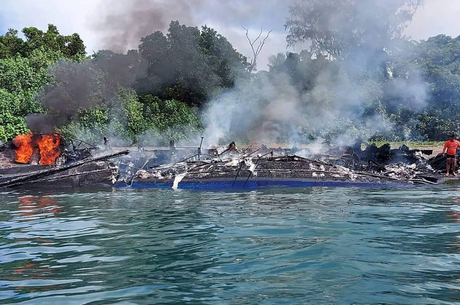The remains of a passenger ferry after fire near the town of Real, Quezon province, Philippines, May 23, 2022. (Philippine Coast Guard via AFP)