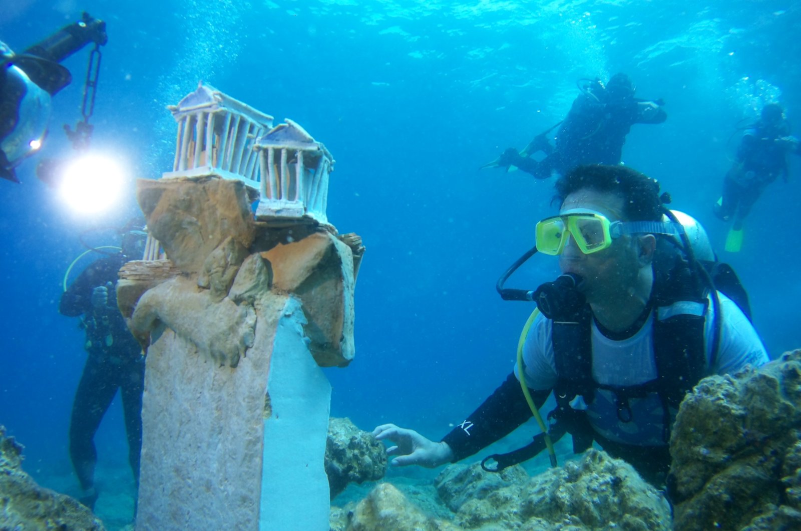 Around 22 ceramic and sculpture pieces have been started to be displayed in an underwater exhibition in the Bodrum district of Muğla, Turkey, May 23, 2022. (AA Photo)