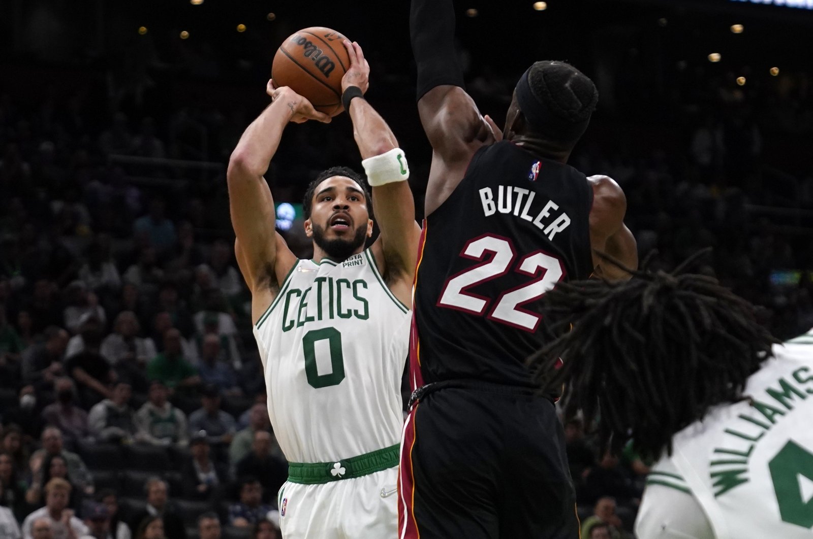 Celtics forward Jayson Tatum (L) shoots over Heat forward Jimmy Butler during NBA Eastern Conference finals Game 4, Boston, U.S., May 23, 2022. (AP Photo)