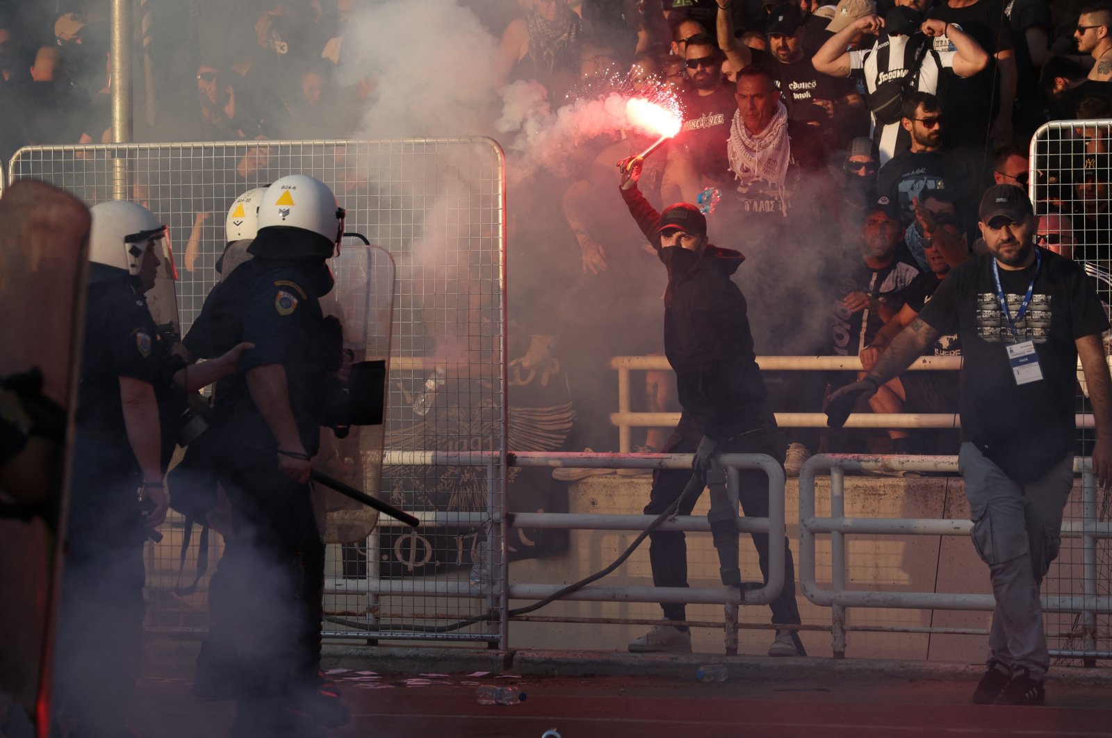 Police and fans clash before the Greek Cup final between Panathinaikos and PAOK, Athens, Greece, May 21, 2022. (Reuters Photo)