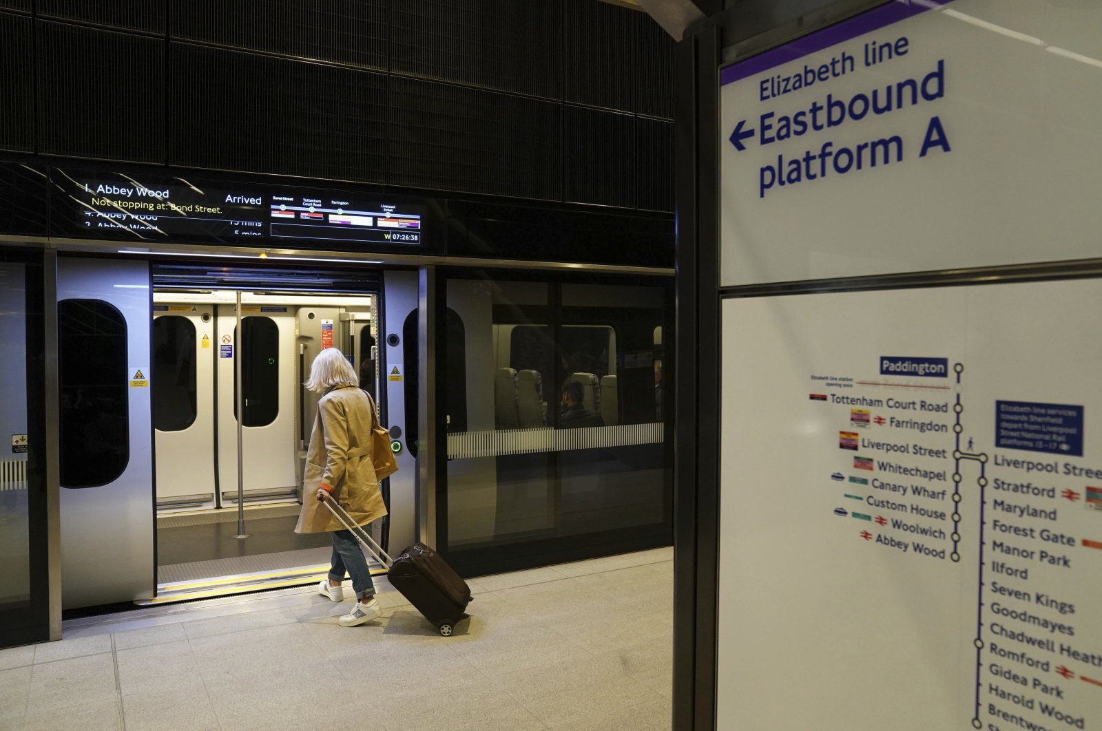 A passenger boards an Elizabeth line train at Paddington Station, London, U.K., May 24, 2022. (AP Photo)