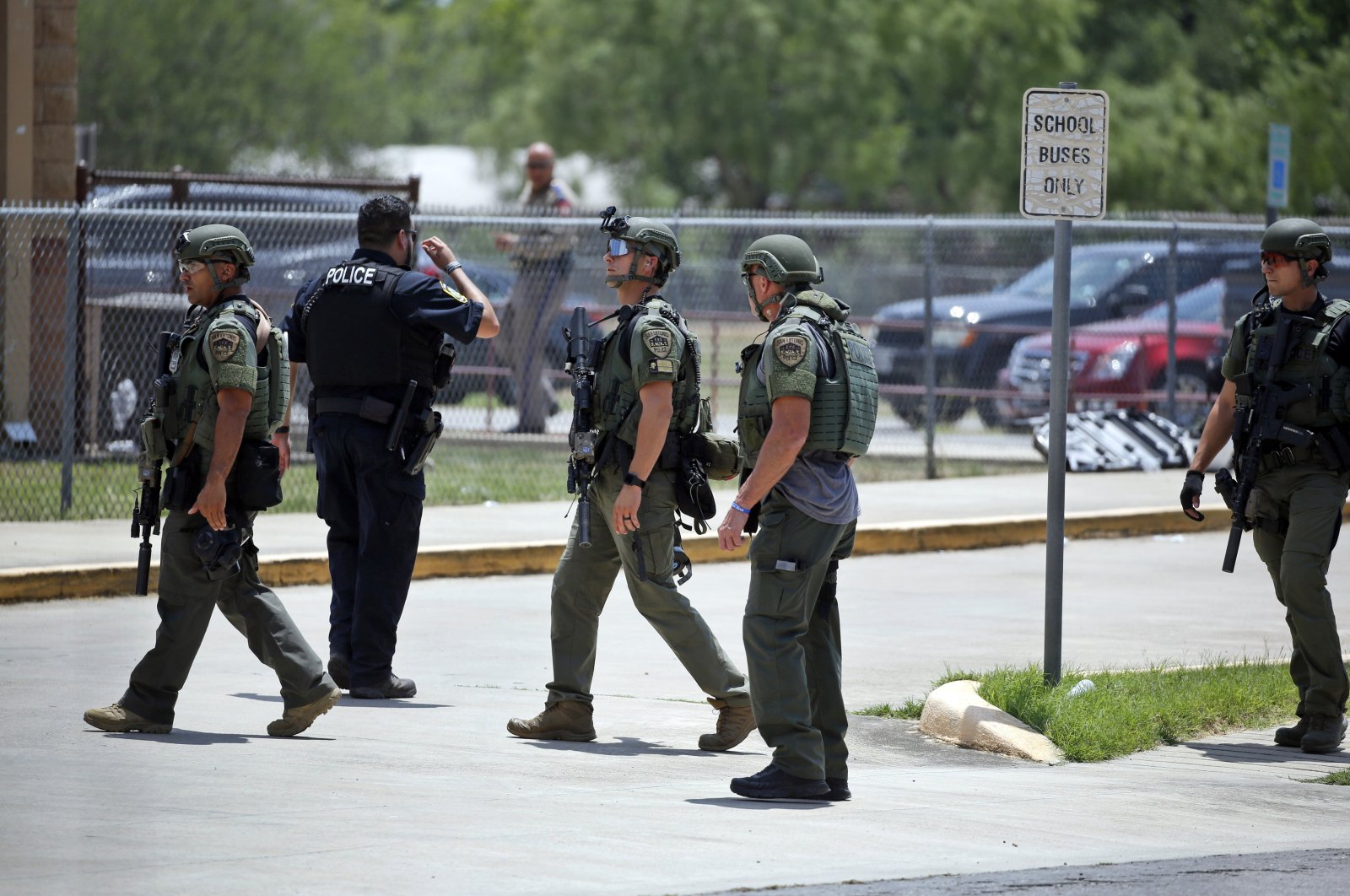 Law enforcement personnel stand outside Robb Elementary School following the shooting, Uvalde, Texas, U.S., May 24, 2022. (AP Photo)