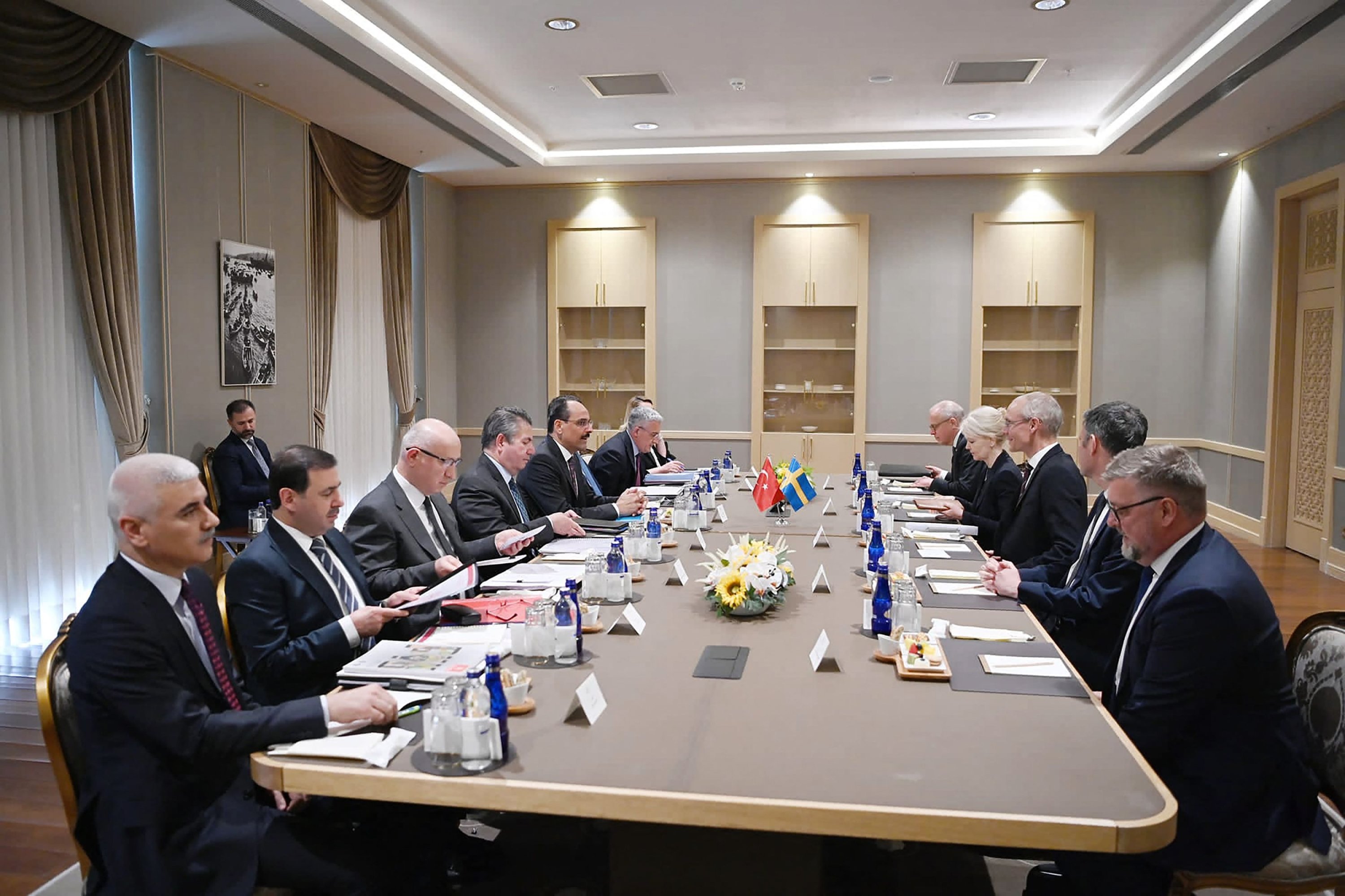 This handout photo taken and released by the Turkish presidential press service on May 25, 2022, shows Turkish Presidential spokesperson Ibrahim Kalin (5th L) and Swedish State Secretary with responsibility for foreign affairs and the Security Policy Council Oscar Stenstrom (3rd R) attending a meeting over Sweden's bid to join NATO in Ankara, Turkey, May 25, 2022. (AFP Photo)