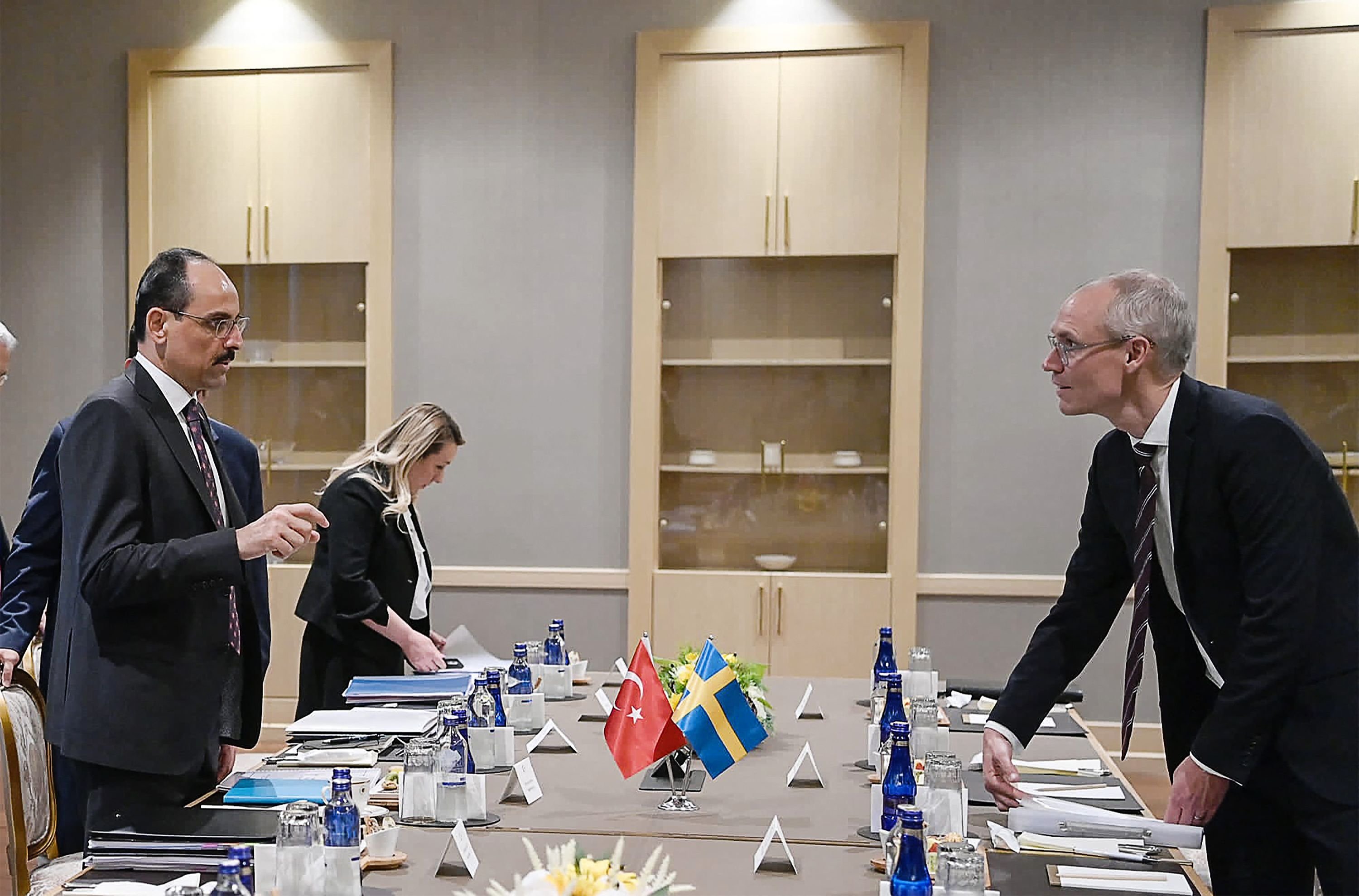 This handout photo taken and released by the Turkish presidential press service on May 25, 2022, shows Turkish Presidential spokesperson Ibrahim Kalin (L) and Swedish State Secretary with responsibility for foreign affairs and the Security Policy Council Oscar Stenstrom (R) speaking before a meeting over Sweden's bid to join NATO in Ankara. - Turkey on May 25 said the NATO accession process for Sweden and Finland would not move forward unless they addressed Ankara's security concerns, in talks with delegations from both Nordic states, Ankara, Turkey, May 25, 2022. (AFP Photo)