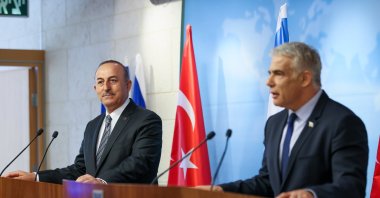 Foreign Minister Mevlüt Çavuşoğlu (L) speaks during a press conference with his Israeli counterpart Yair Lapid in Israel, May 25, 2022. (AA Photo)