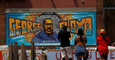 Community members visit one of the murals at George Floyd Square where George Floyd was killed in police custody two years before, Minneapolis, Minnesota, U.S., June 3, 2021. (Reuters Photo)