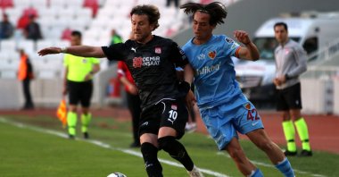 Sivasspor&#039;s Sefa Yılmaz (L) vies with Kayserispor&#039;s Ethem Balcı in a Süper Lig match, Sivas, Turkey, May 21, 2022.