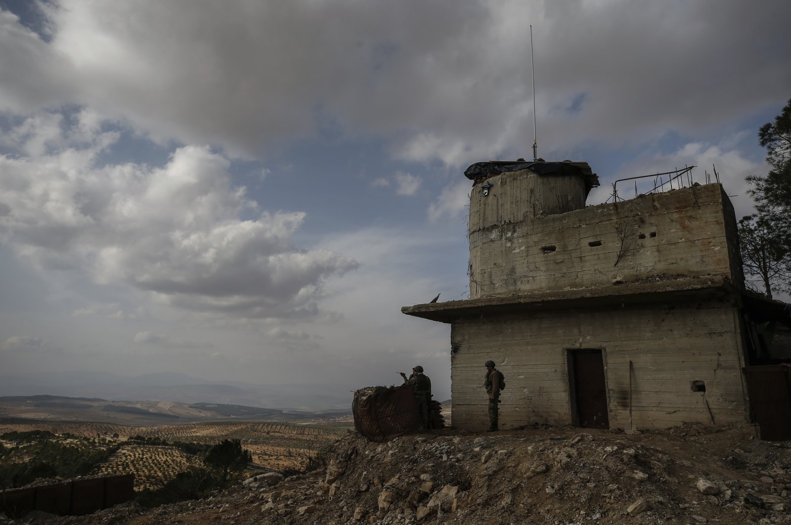 Turkish soldiers hold a position atop the Bursayah hill in the greater Afrin district, Syria, Saturday, March 3, 2018. (AP File Photo)