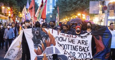 Several hundred people from the left-wing spectrum protest against police violence and racism during a march through the city center in Frankfurt/Main, Germany, May 3, 2022. (AP Photo)