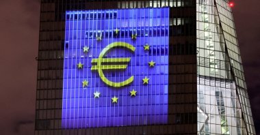 A symphony of light consisting of bars, lines and circles in blue and yellow, the colors of the European Union, illuminates the south facade of the European Central Bank (ECB) headquarters in Frankfurt, Germany, Dec. 30, 2021. (Reuters Photo)