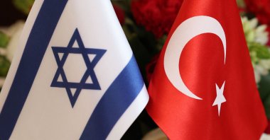 The Turkish (R) and Israeli flags are pictured at a meeting between Foreign Minister Mevlüt Çavuşoğlu and Israeli businesspeople, in Tel Aviv, Israel. May 25, 2022. (AFP Photo)