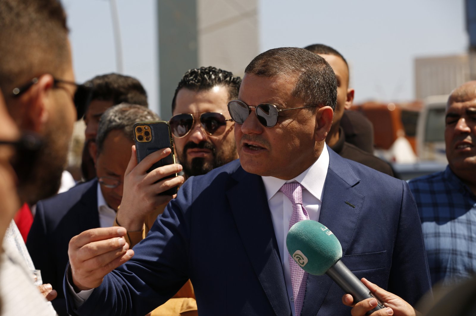 Abdul Hamid Dbeibah, one of Libya’s two rival prime ministers, center, visits a Tripoli neighborhood after competing militias fought there, in Tripoli, Libya, Tuesday, May 17, 2022. (AP File Photo)