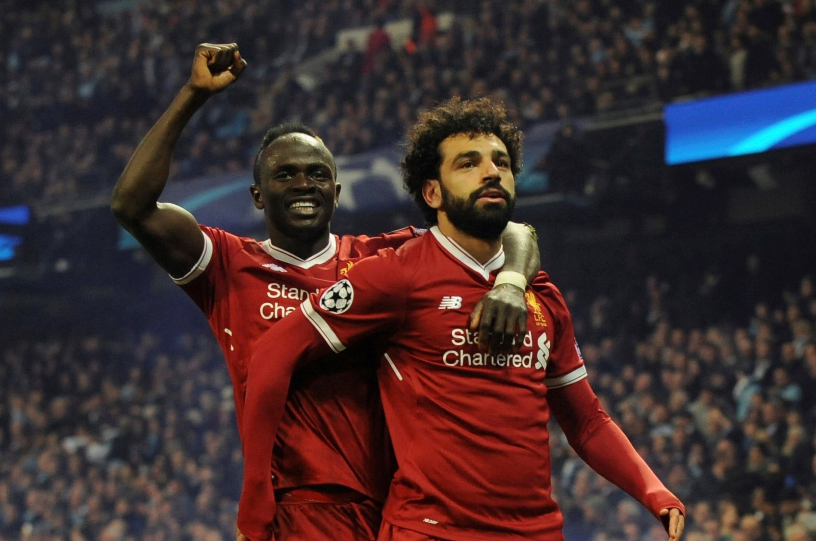Liverpool&#039;s Mohamed Salah (R) celebrates with teammate Sadio Mane after scoring in a Champions League quarterfinal match against Man City, Manchester, England, April 10, 2018. (AP Photo)