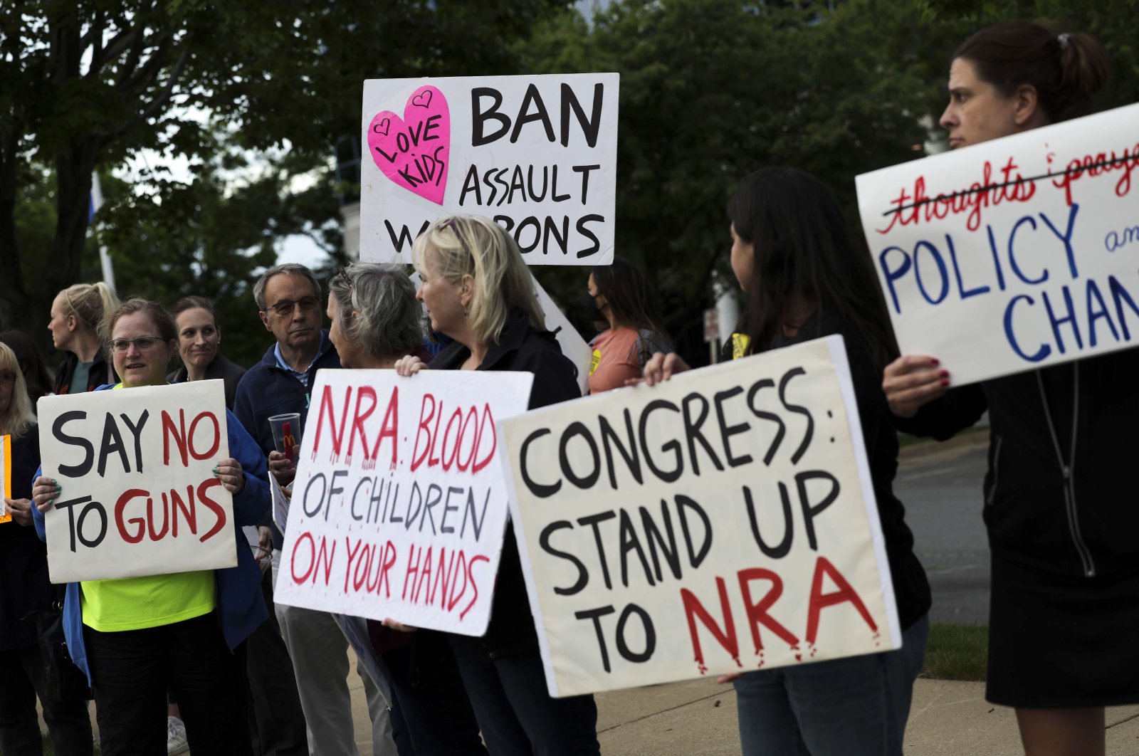 Gun-control advocates hold a vigil outside of the National Rifle Association (NRA) headquarters following the recent mass shooting at Robb Elementary School, Virginia, U.S., May 25, 2022. (AFP Photo)
