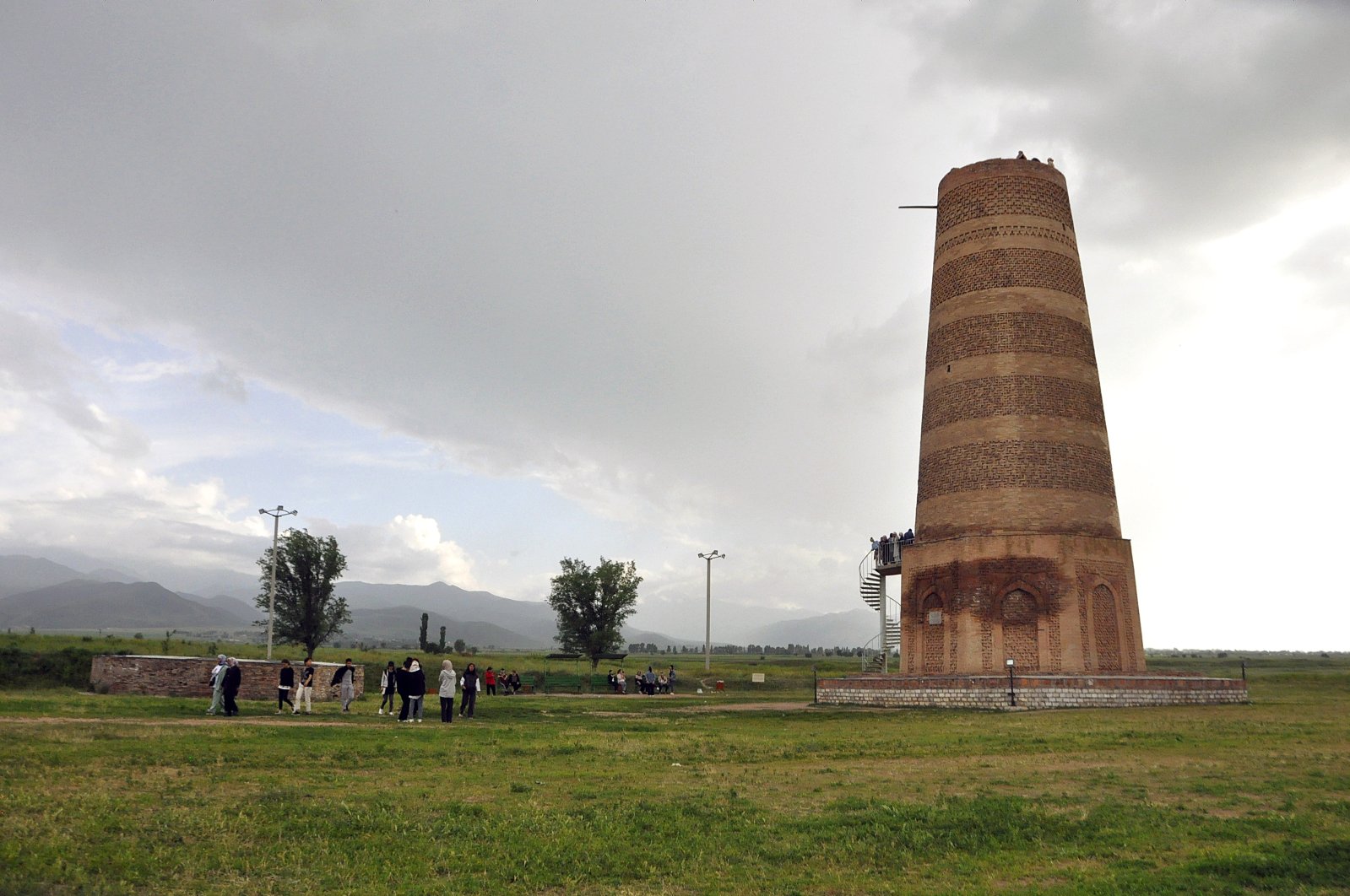 The round-shaped Burana Tower in Kyrgyzstan is frequently visited by local and foreign tourists for its history and architecture, Bishkek, Kyrgyzstan, May 25, 2022. (AA Photo)