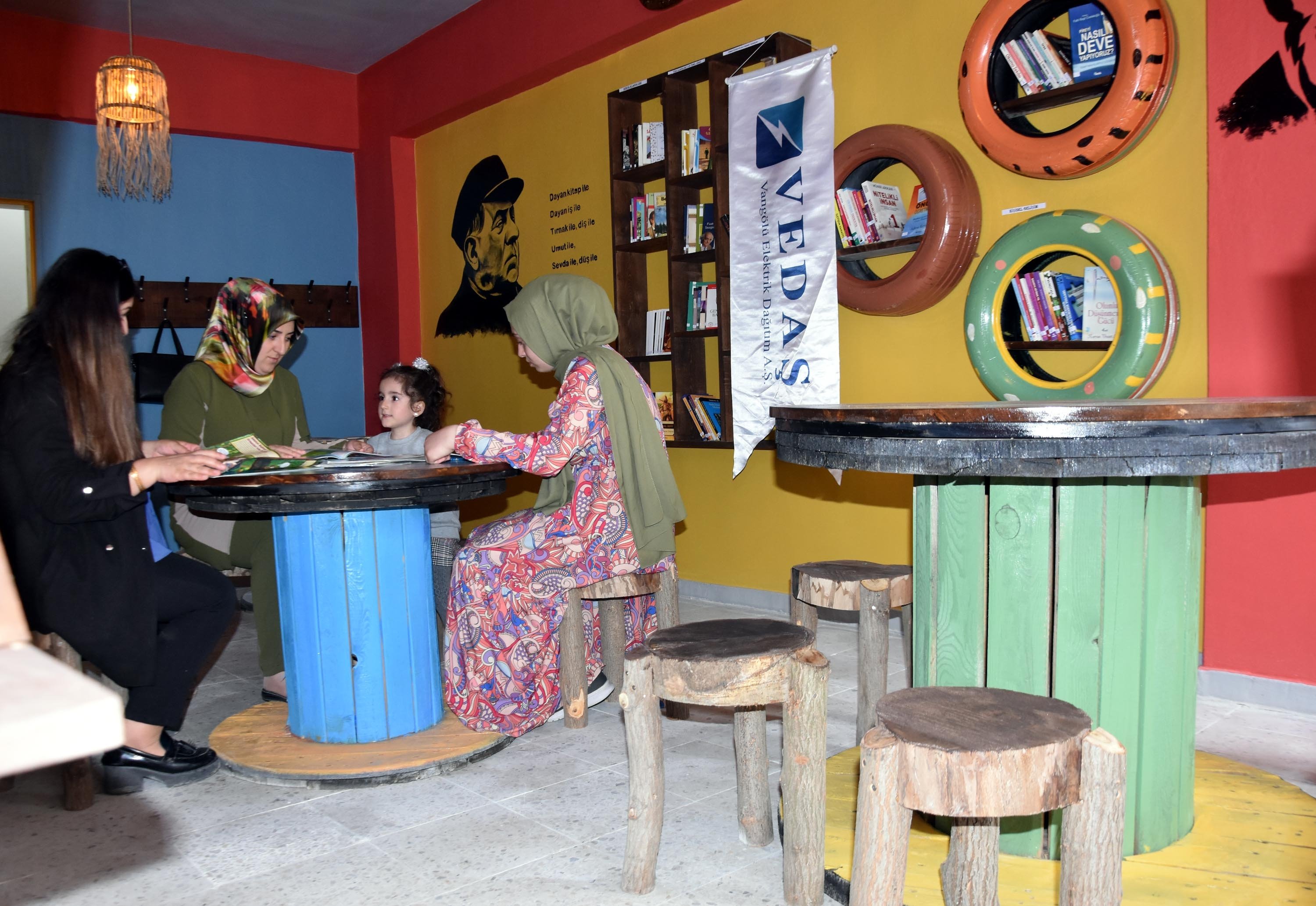 The zero-cost library made from waste such as pallets, reels, rubber tires and logs was established by the Public Education Center in Bitlis, southeastern Turkey, on May 27 2022. (DHA Photo)