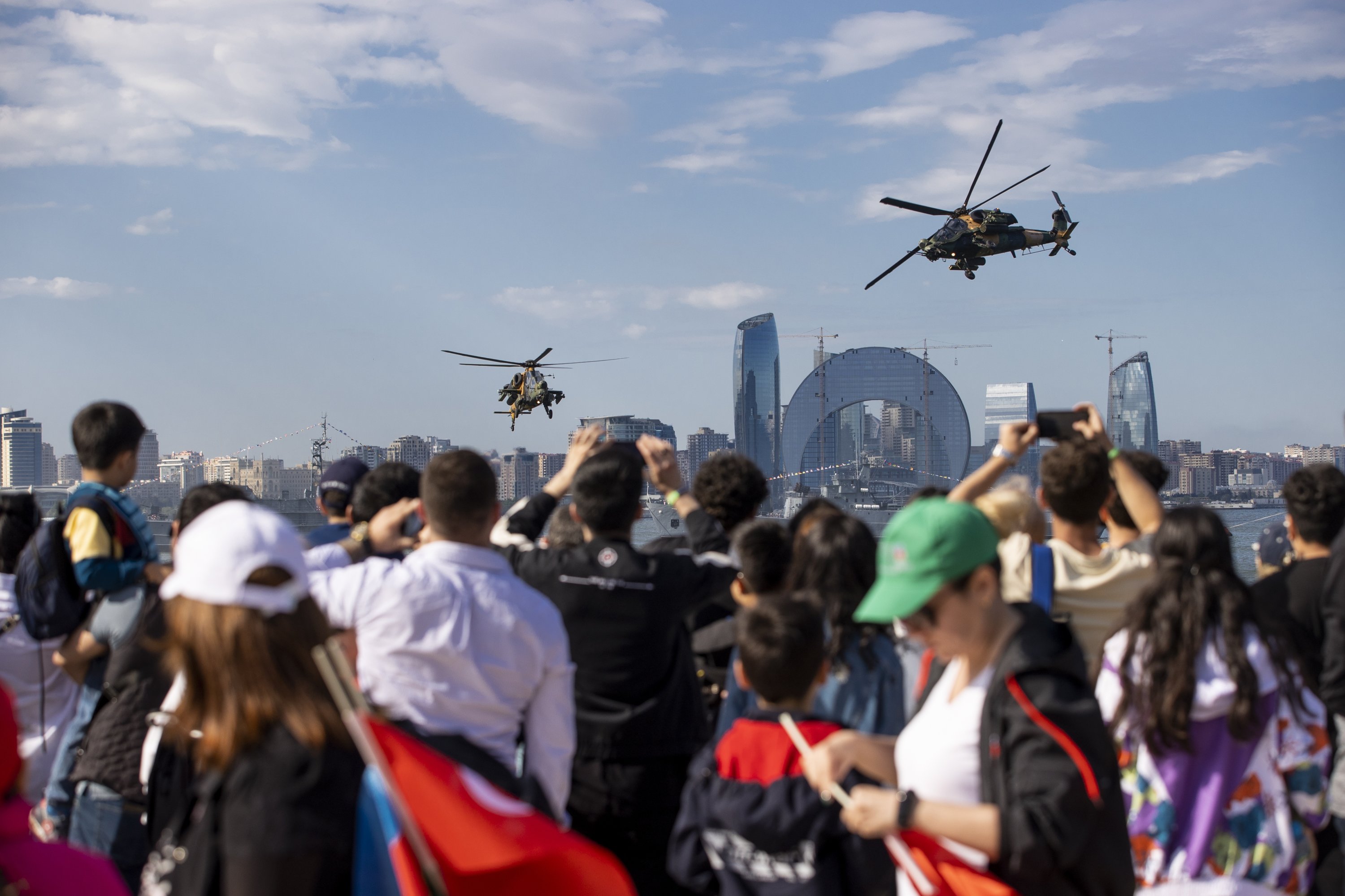 T129 Tactical Reconnaissance and Attack Helicopters (ATAK) fly in the capital Baku during the aerospace and technology festival Teknofest, Azerbaijan, May 27, 2022. (AA Photo)