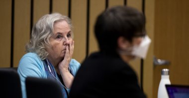 Romance writer Nancy Crampton Brophy, (L), accused of killing her husband, Dan Brophy, in June 2018, watches proceedings in court in Portland, Oregon, U.S., April 4, 2022. (AP)