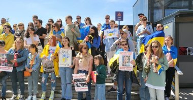 Ukrainian demonstrators holding banners protest the Ukraine-Russia war in Beyoğlu, Istanbul, Turkey, May 7, 2022. (İHA Photo)