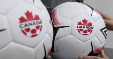 A staff adjusts balls at Soccer Canada Headquarters in Ottawa, Ontario, June 13, 2018. (AFP Photo)