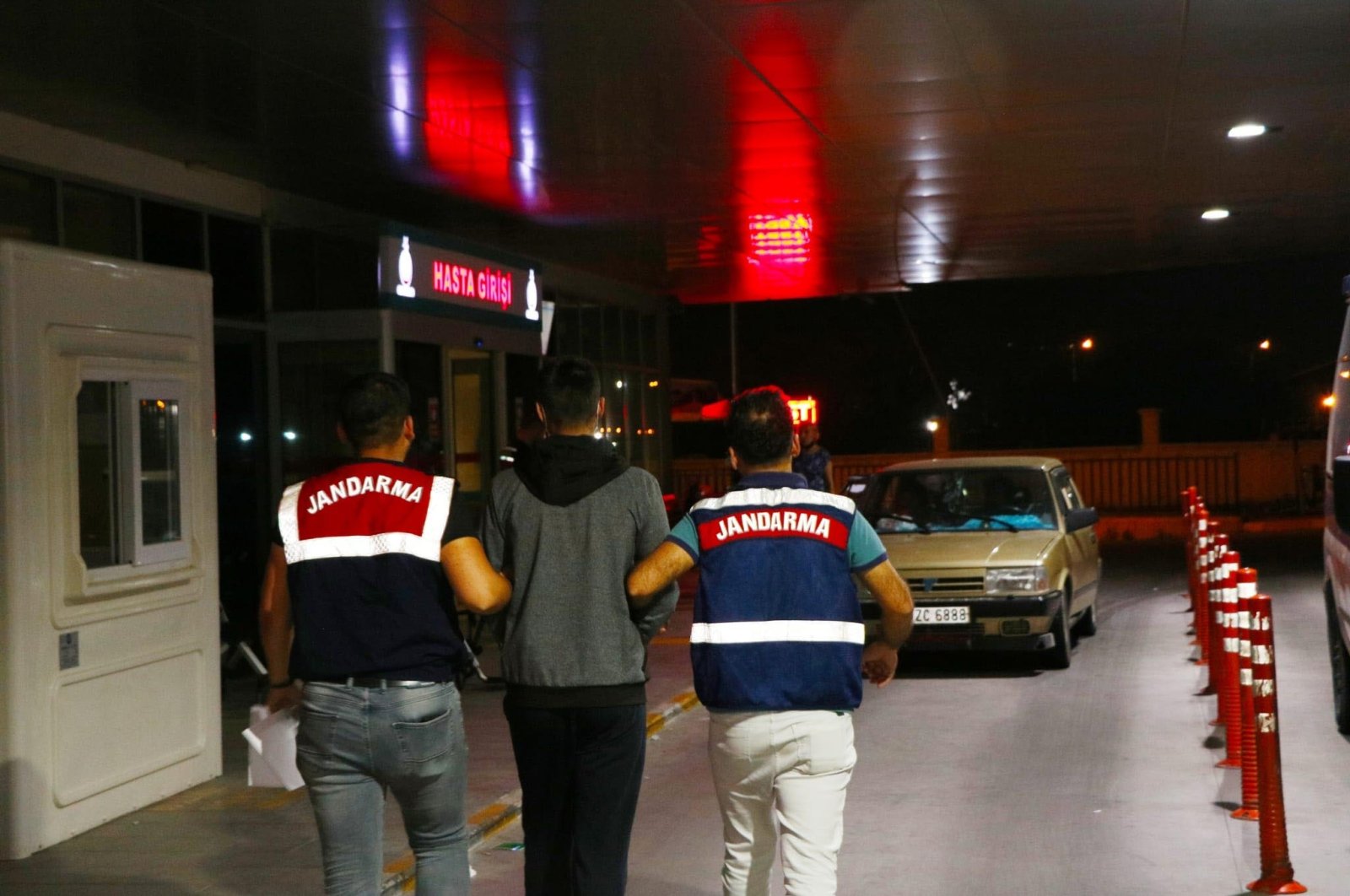 Gendarmerie officers escort a captured FETÖ suspect, in Izmir, western Turkey, May 24, 2022. (DHA PHOTO) 